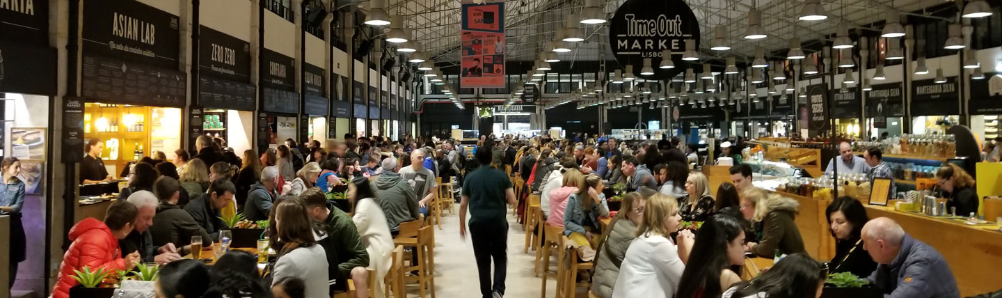 photo of person walking down the aisle at Time Out Market