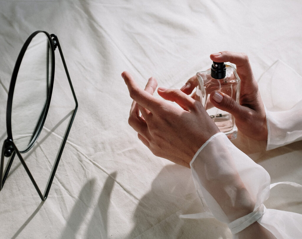 hand with perfume bottle